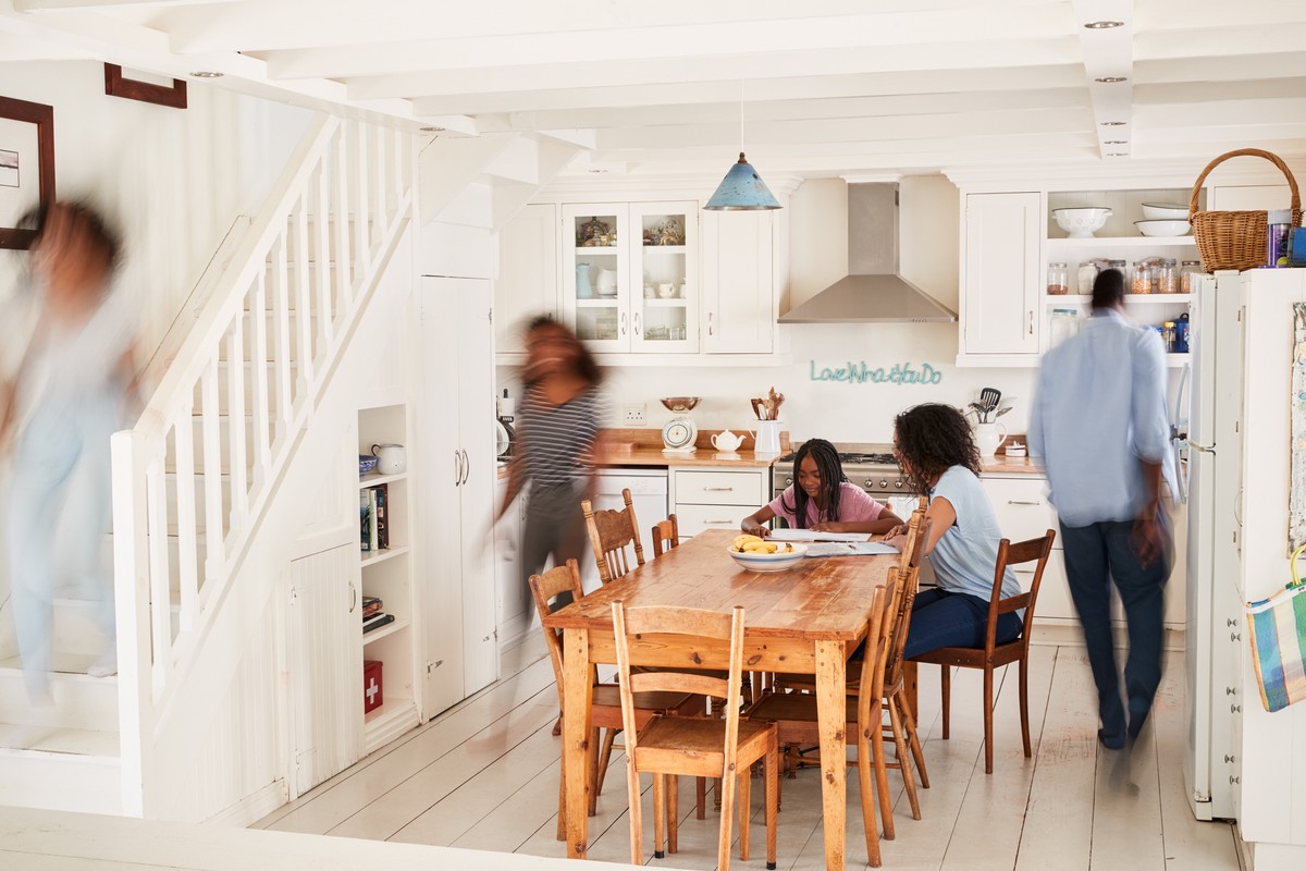 interior of busy family home with blurred figures